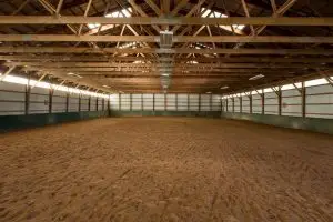 Custom horse barn with stalls and tack room in Texas