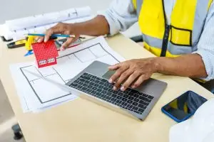 Barndominium construction site with permit board in Central Texas