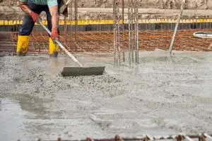 Construction crew laying rebar for a robust concrete foundation in Texas.