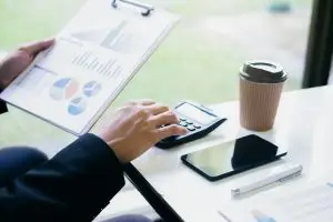 Person reviewing loan documents for barndominium construction financing in Texas.