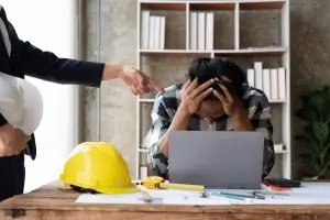 Construction expert reviews barndominium blueprints, highlighting meticulous planning.